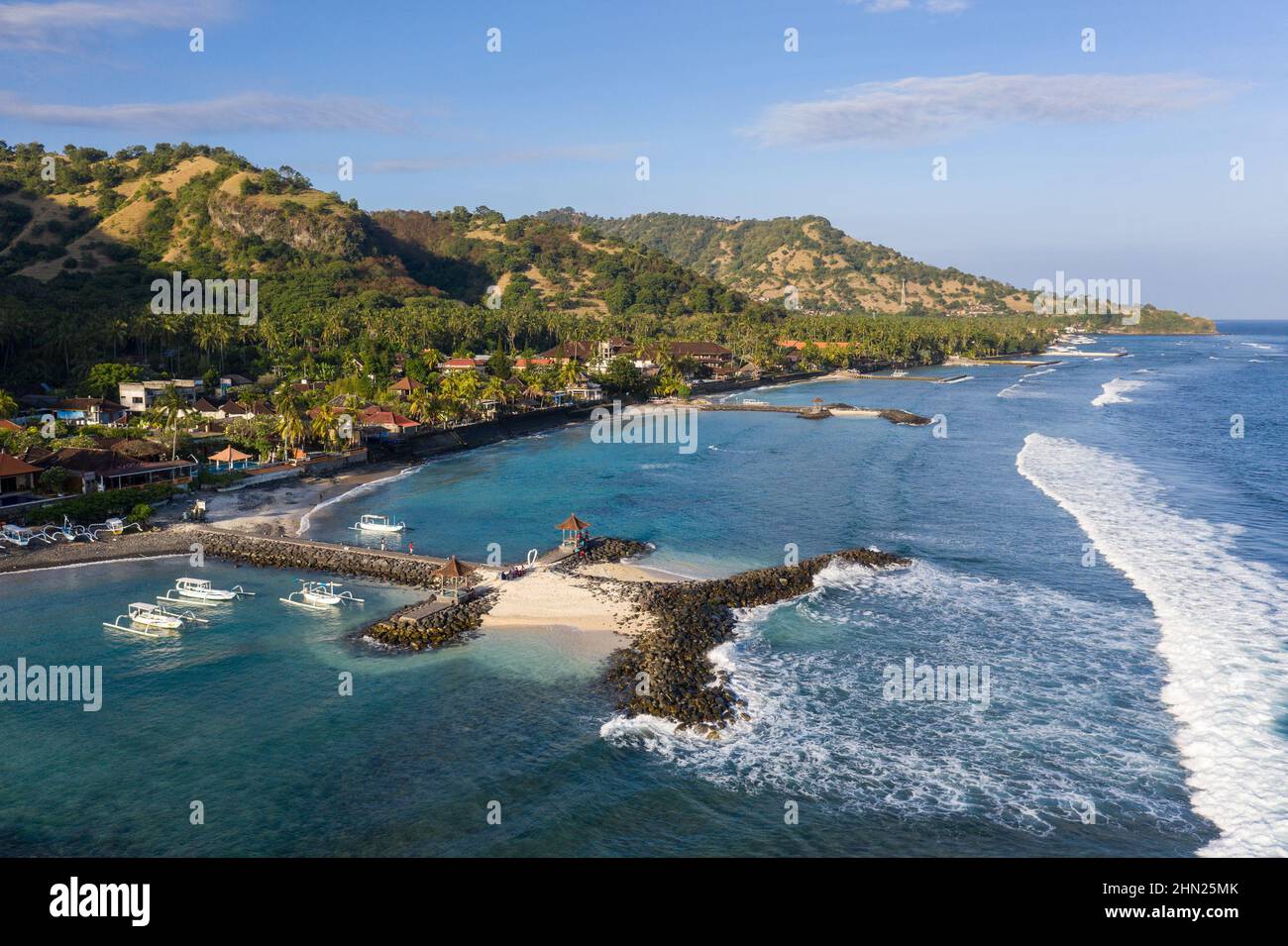 Dramatic aerial view of the Candidasa coast and resort town in eastern Bali on a sunny day in Indonesia Stock Photo