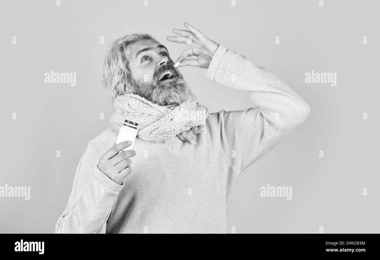 Painkillers pills. Headache treatment. Sick man with vitamin pills