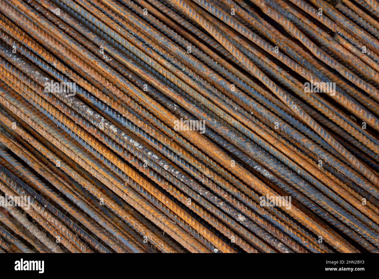 Rusty steel rod texture background, reinforcement metal bars for