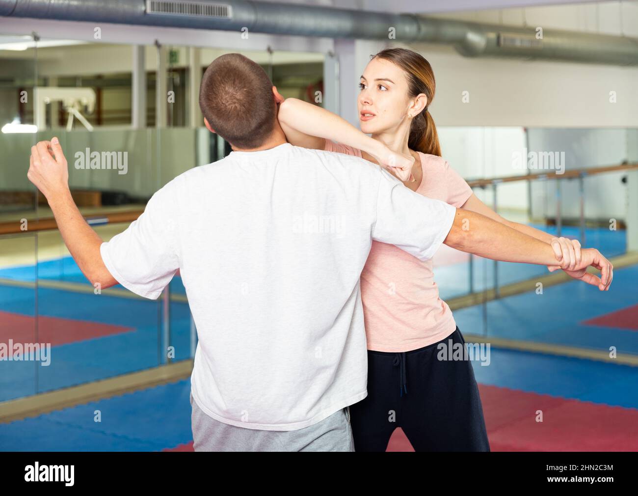 Woman performing elbow strike during selfdefence training Stock Photo Alamy