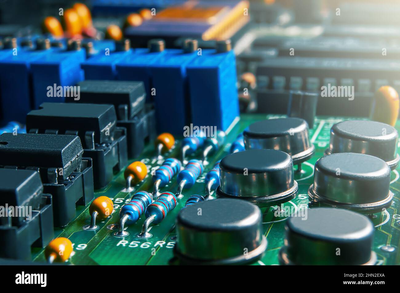 Closeup of Printed Circuit Board with integrated circuits and many
