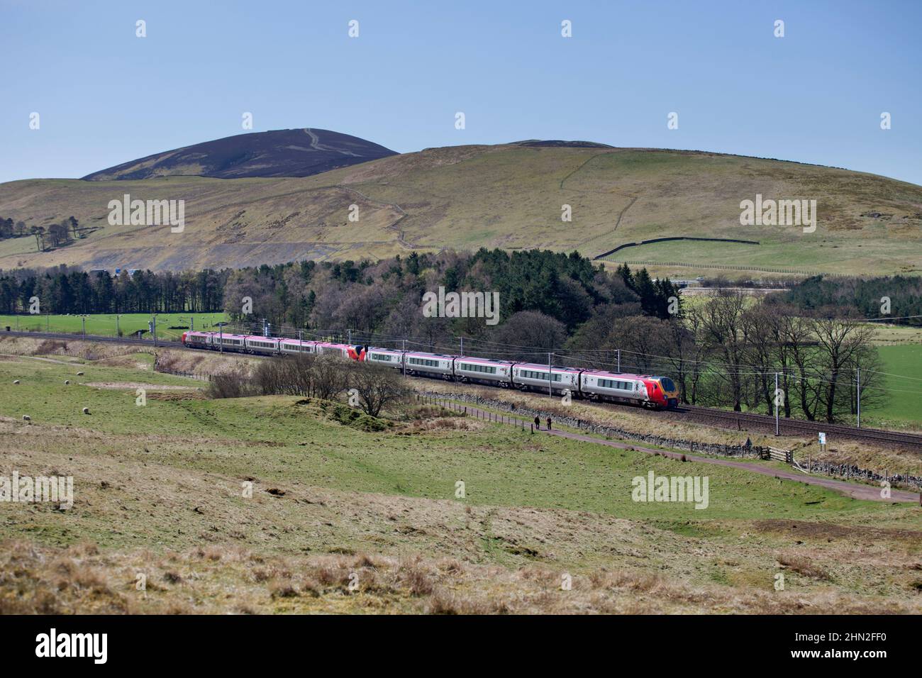 2 Virgin Trains Bombardier class 221 voyager trains passing  Abington in the countryside of the Cylde valley on the west coast mainline, Scotland, UK Stock Photo