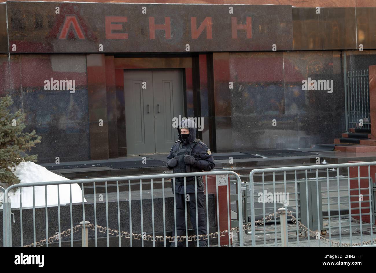 Lenin's mausoleum and a security guard in winter Stock Photo