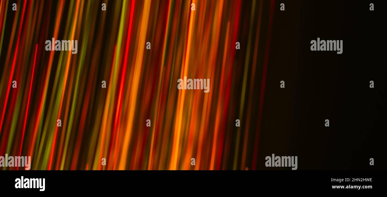 Multi colored rays on a dark background. Abstraction. Drawing with ...