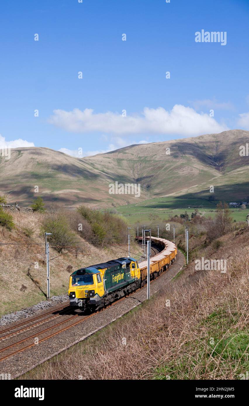 Freightliner class 70 diesel locomotive in the Cumbrian countryside on ...