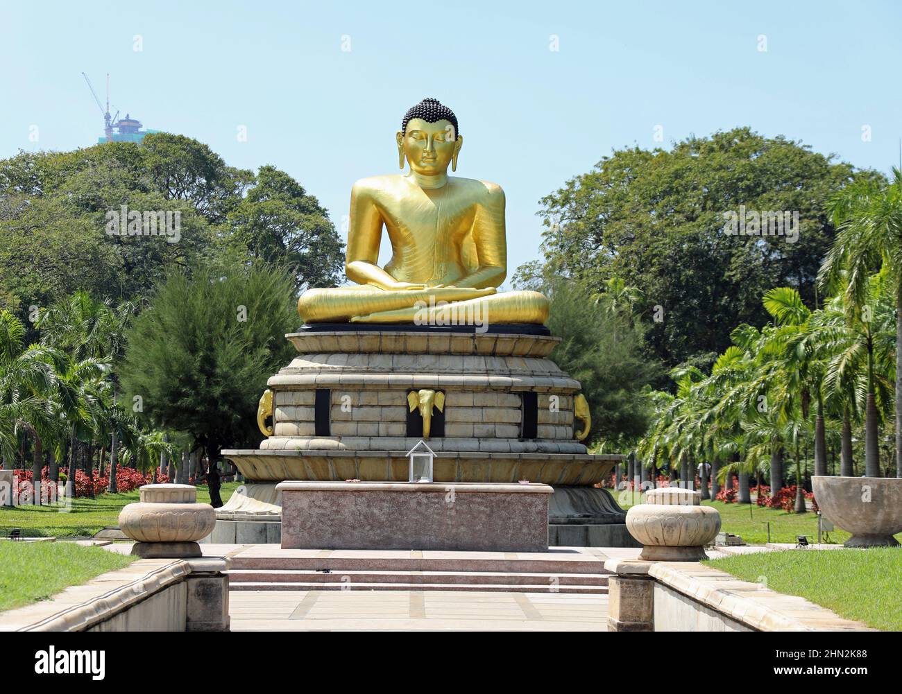 Golden Buddha statue at the colonial era Victoria Park in Colombo Stock Photo