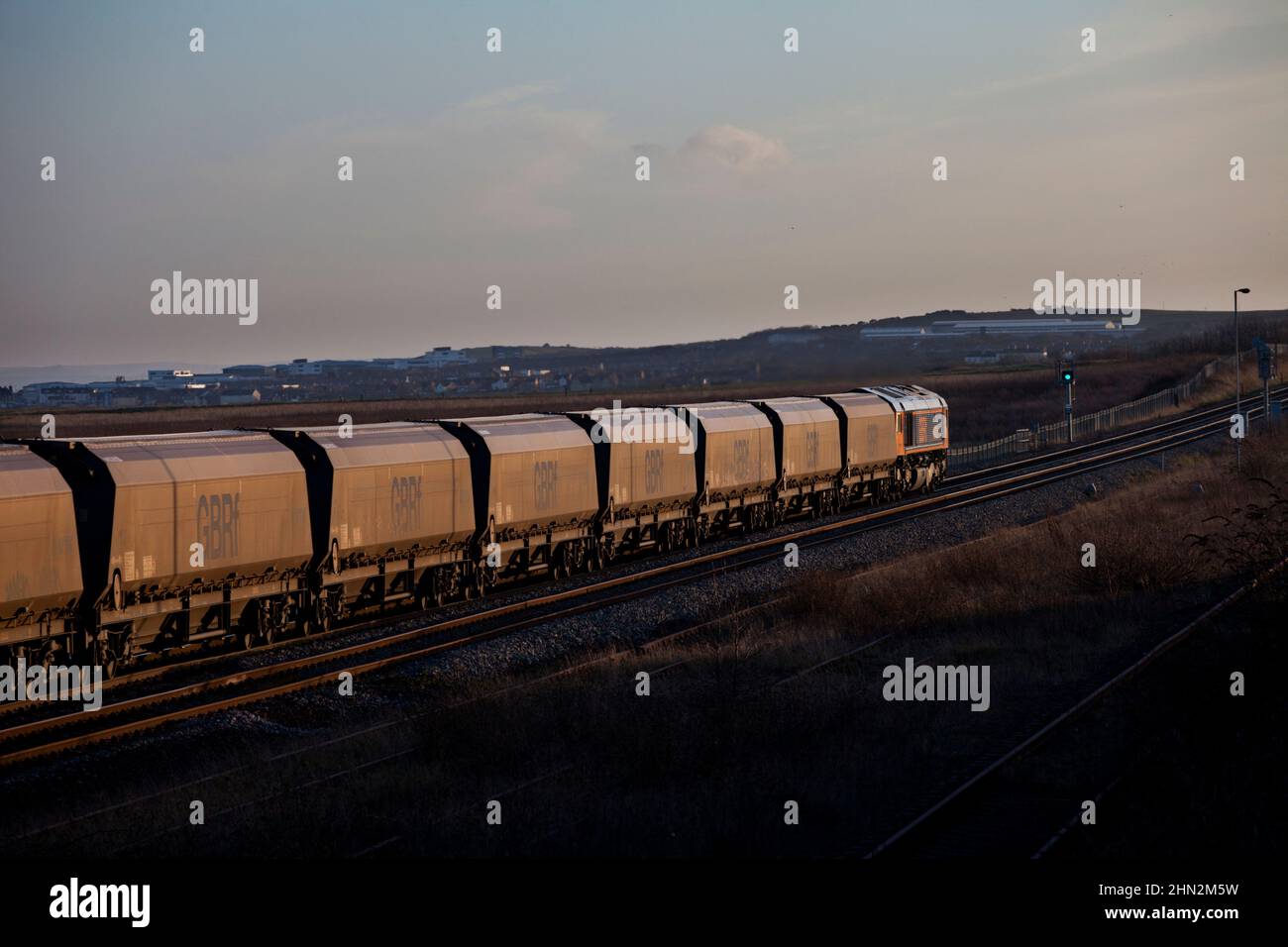 GB Railfreight freight train carrying biomass for Drax in the evening  winter sunlight Stock Photo