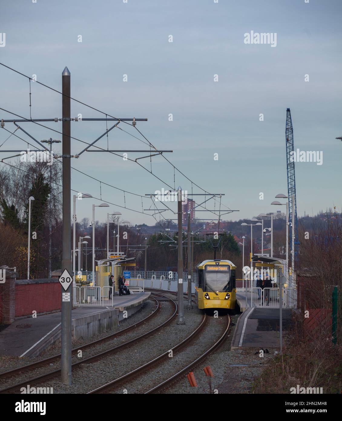 Manchester Metrolink Bombardier Flexity M5000 tram 3030  at Holinwood  tram stop on the off street section Stock Photo