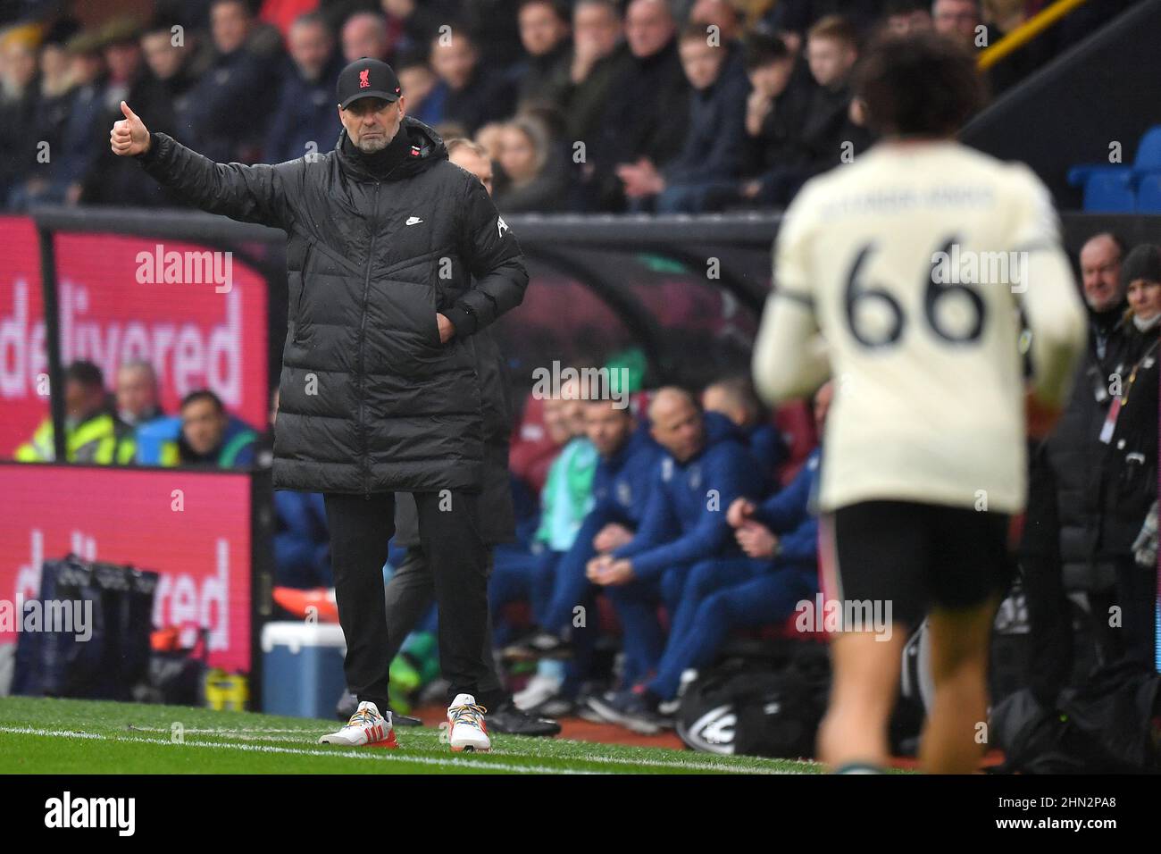 Burnley, UK. 13th Feb, 2022. Liverpool manager Jurgen Klopp gestures towards Liverpool's Trent Alexander-Arnold during the Premier League match at Turf Moor, Burnley, UK. Picture date: Sunday February 13, 2022. Photo credit should read: Anthony Devlin Credit: Anthony Devlin/Alamy Live News Stock Photo