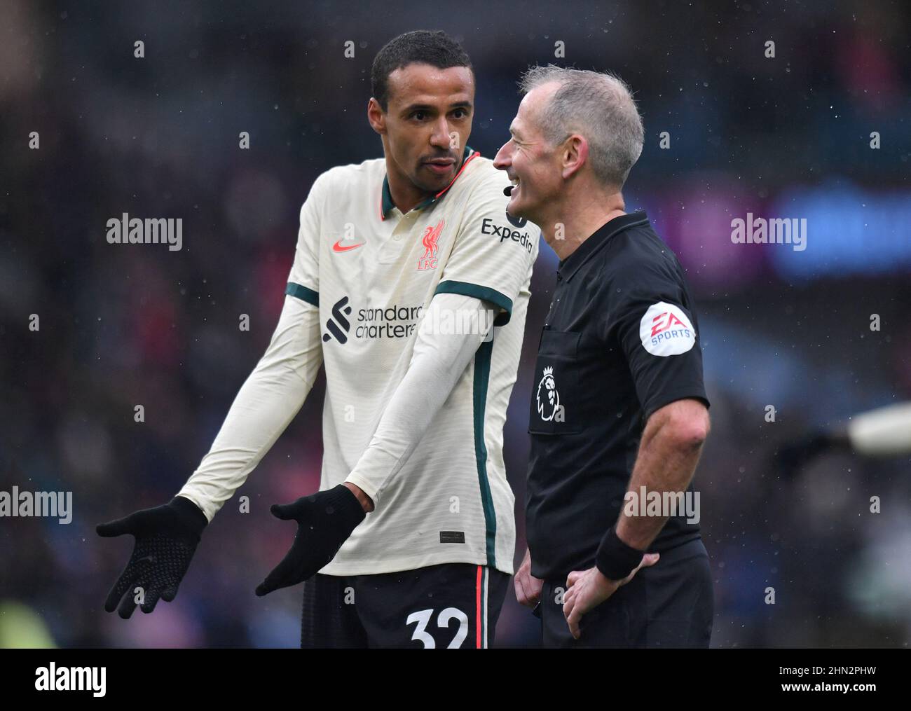 Burnley, UK. 13th Feb, 2022. Liverpool's Joel Matip speaks with Match referee Martin Atkinson during the Premier League match at Turf Moor, Burnley, UK. Picture date: Sunday February 13, 2022. Photo credit should read: Anthony Devlin Credit: Anthony Devlin/Alamy Live News Stock Photo