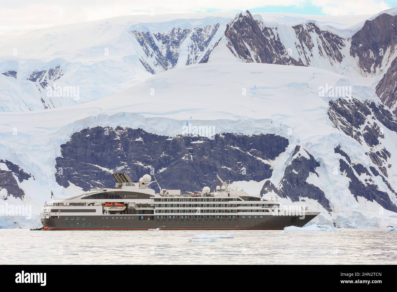 Le Boreal cruise ship in ice strewn Wilhelmina Bay, Antarctica Stock