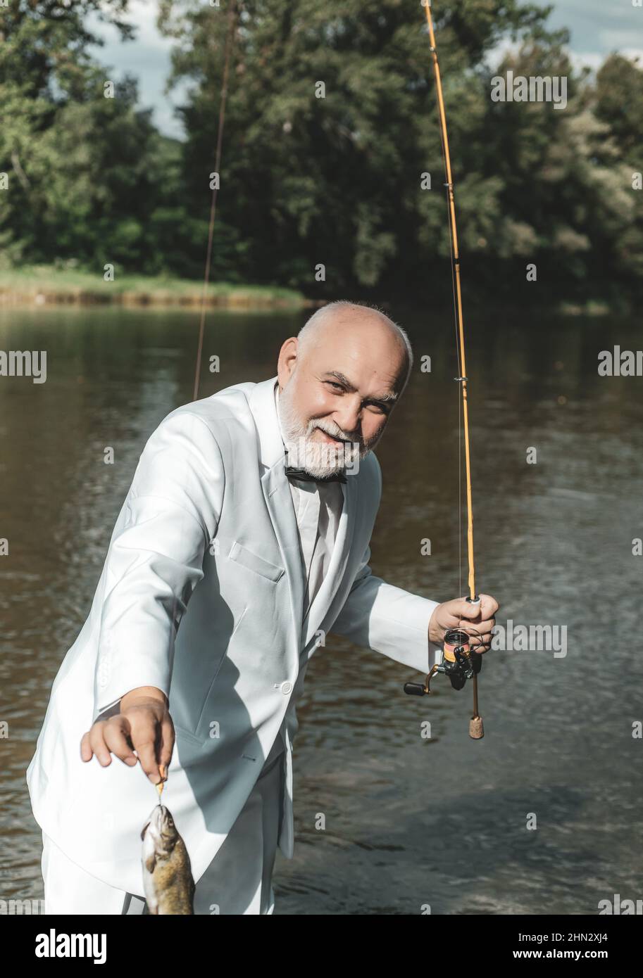 American angler fishing. Still water trout fishing. Handsome mature