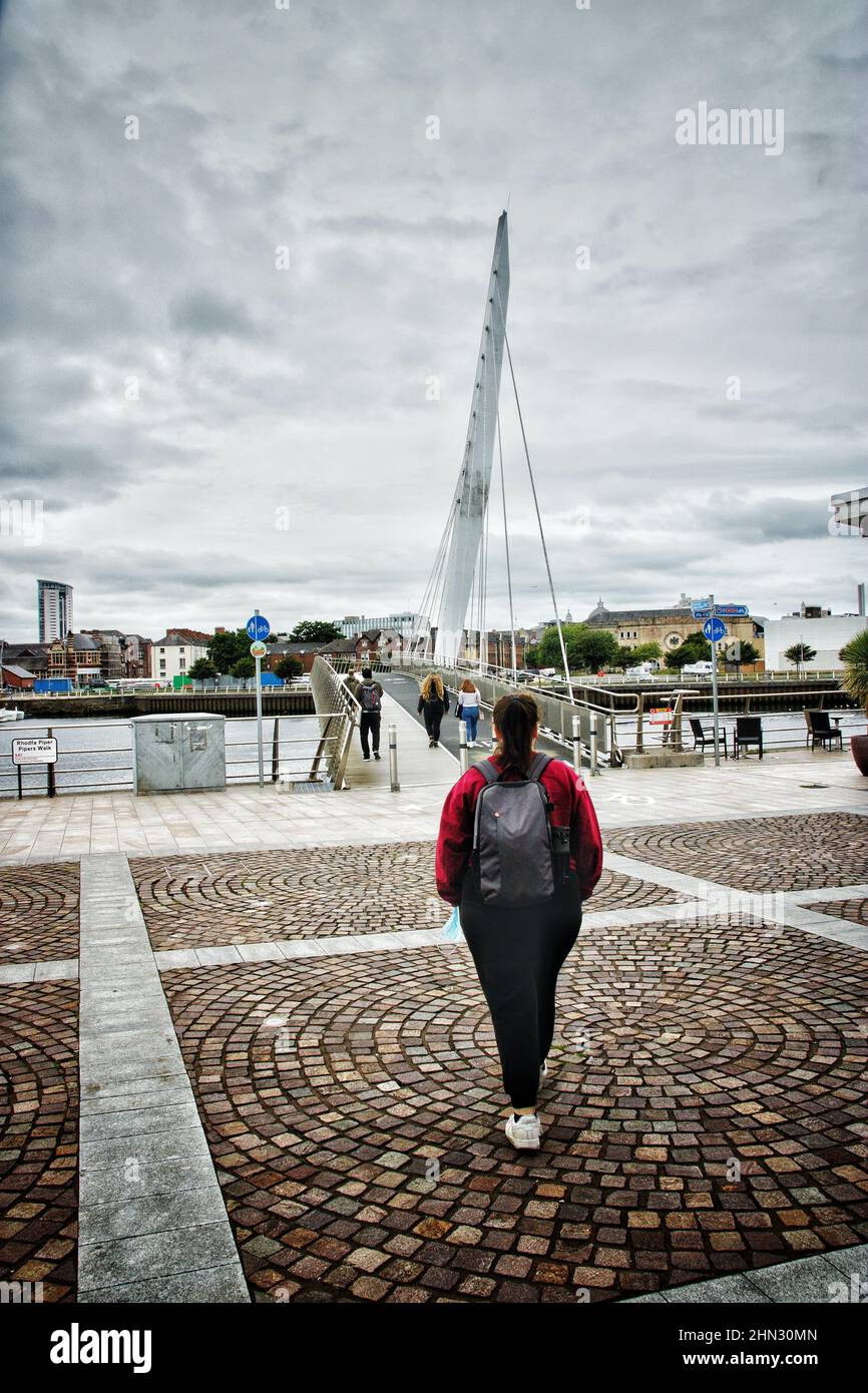 Woman walking with backpack in city hi-res stock photography and images ...