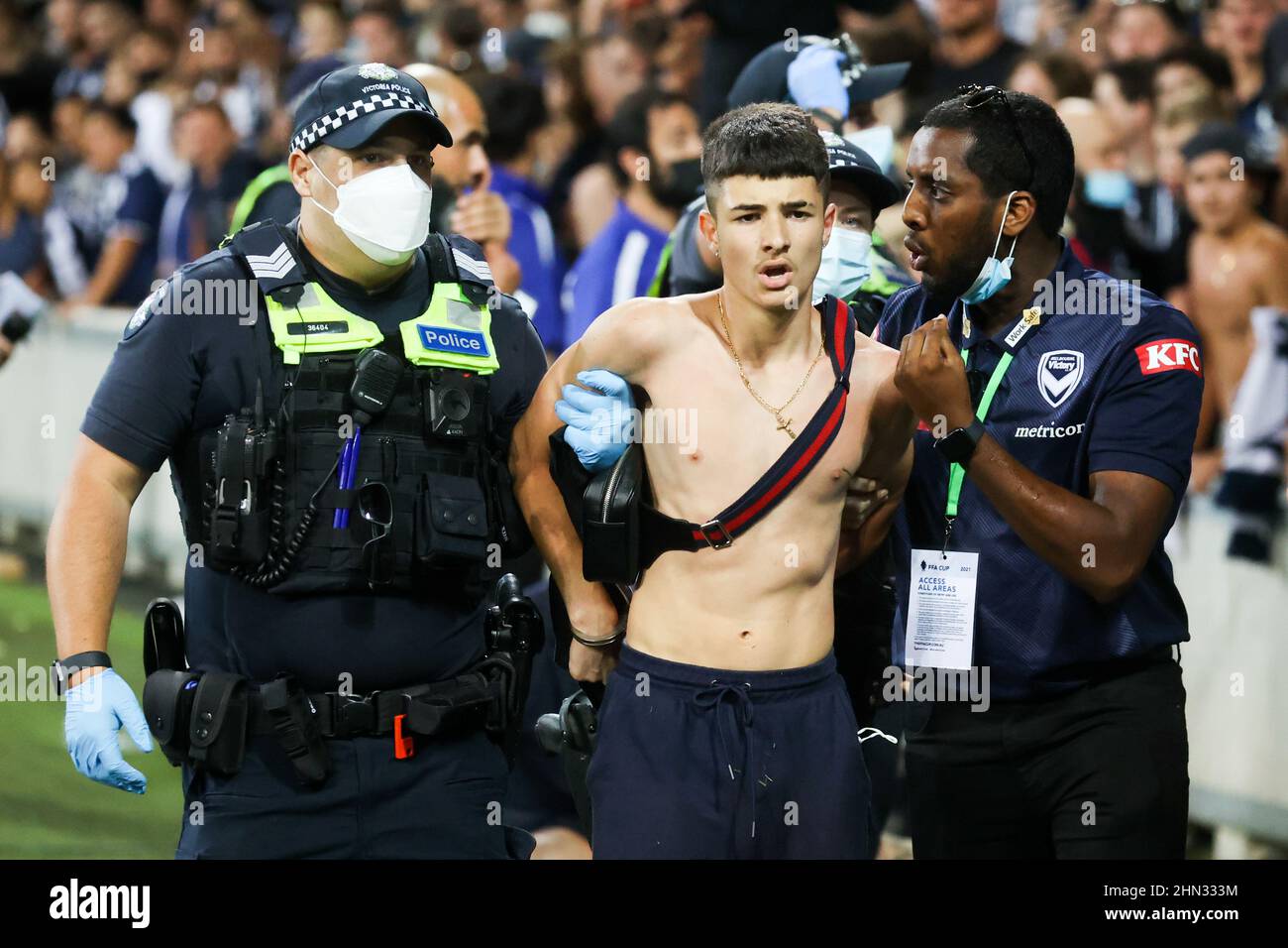 MELBOURNE, AUSTRALIA - FEBRUARY 05: A boy is arrested as fans invade the  pitch during the 2021 FFA Cup Final match between Melbourne Victory and  Centr Stock Photo - Alamy