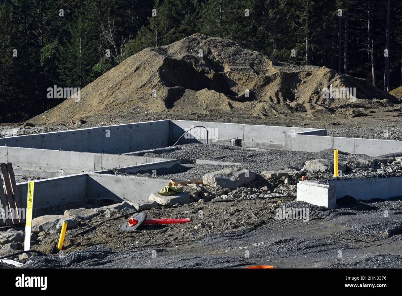 A concrete house foundation in a new residential subdivision in