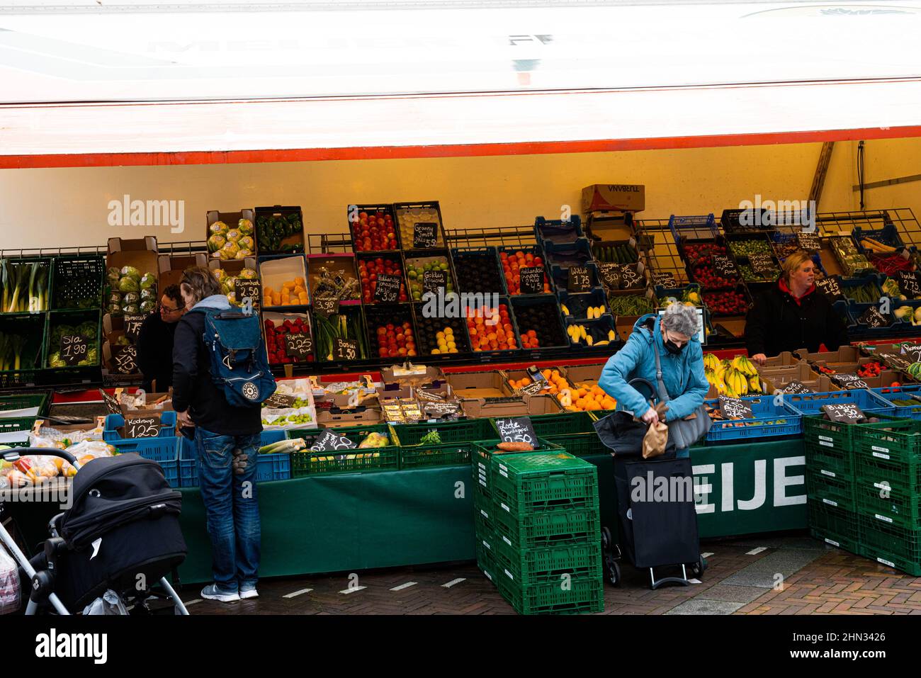 Shopping people at a vegetable market in Haarlem Schalkwijk The Netherlands on 19 January 2022 Stock Photo