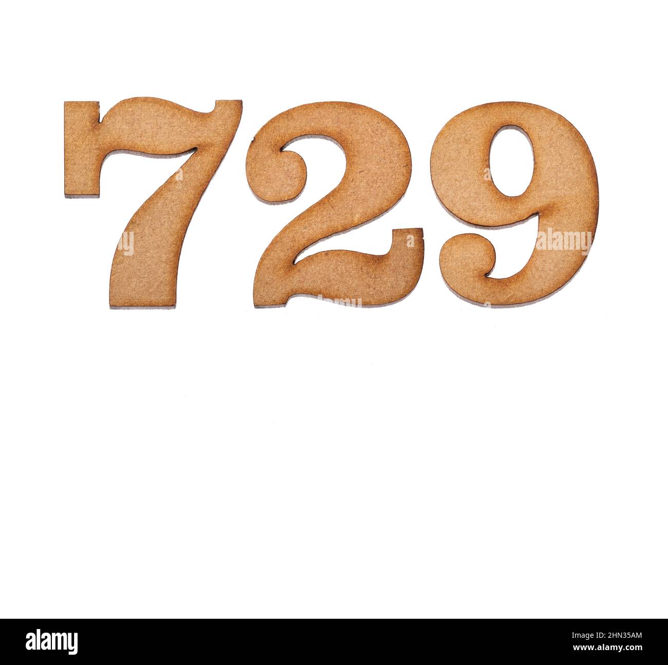 Number 729 in wood, isolated on white background Stock Photo - Alamy