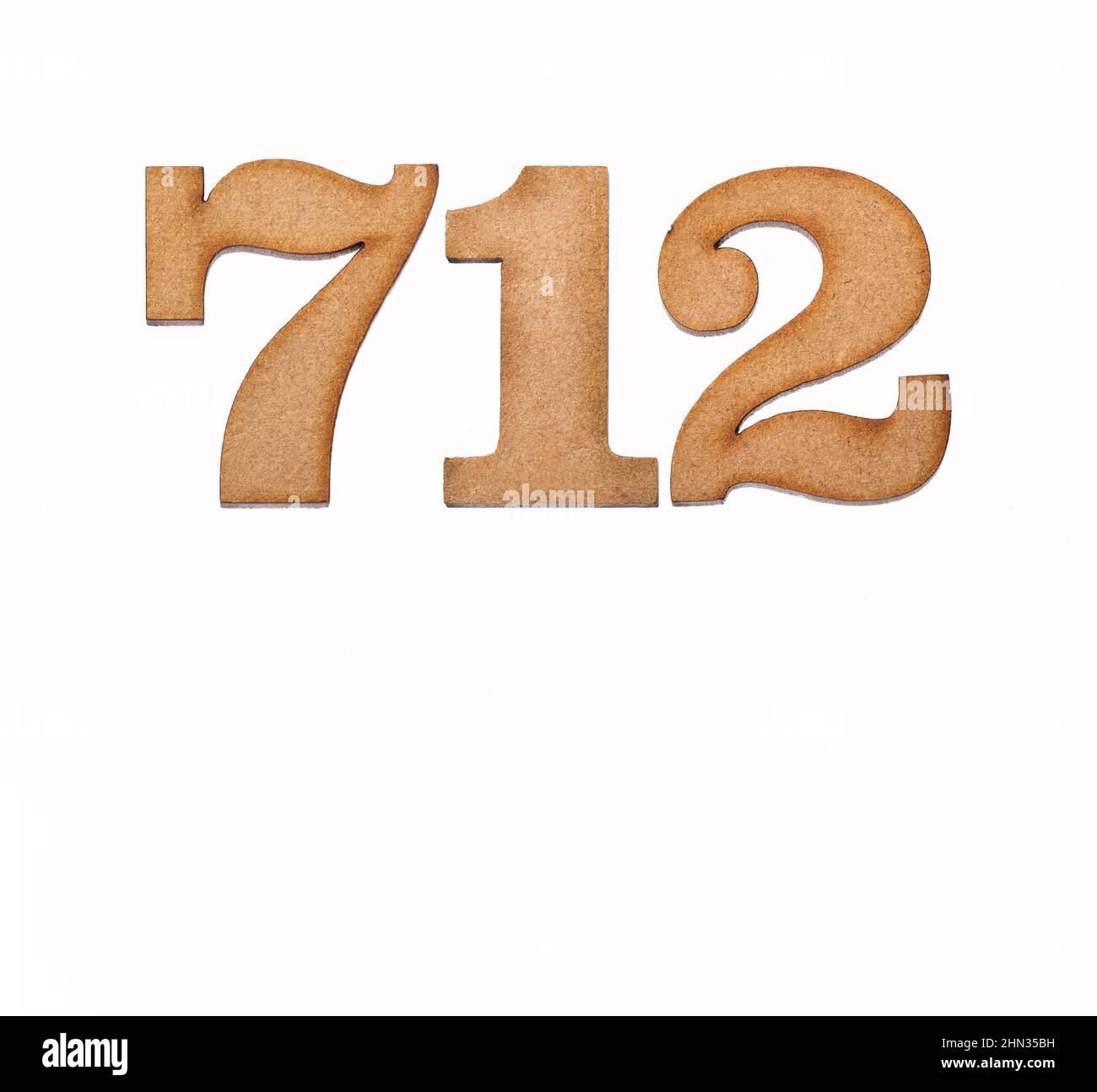 Number 712 - Piece of wood isolated on white background Stock Photo - Alamy