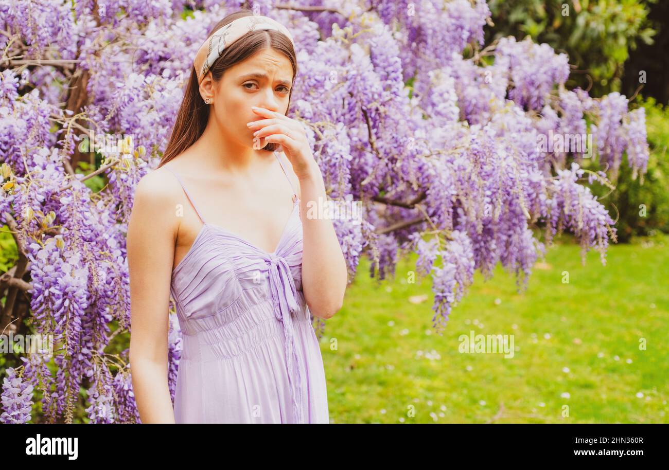 Girl with nose sneezing. Polen allergy symptom concept. Woman being ...