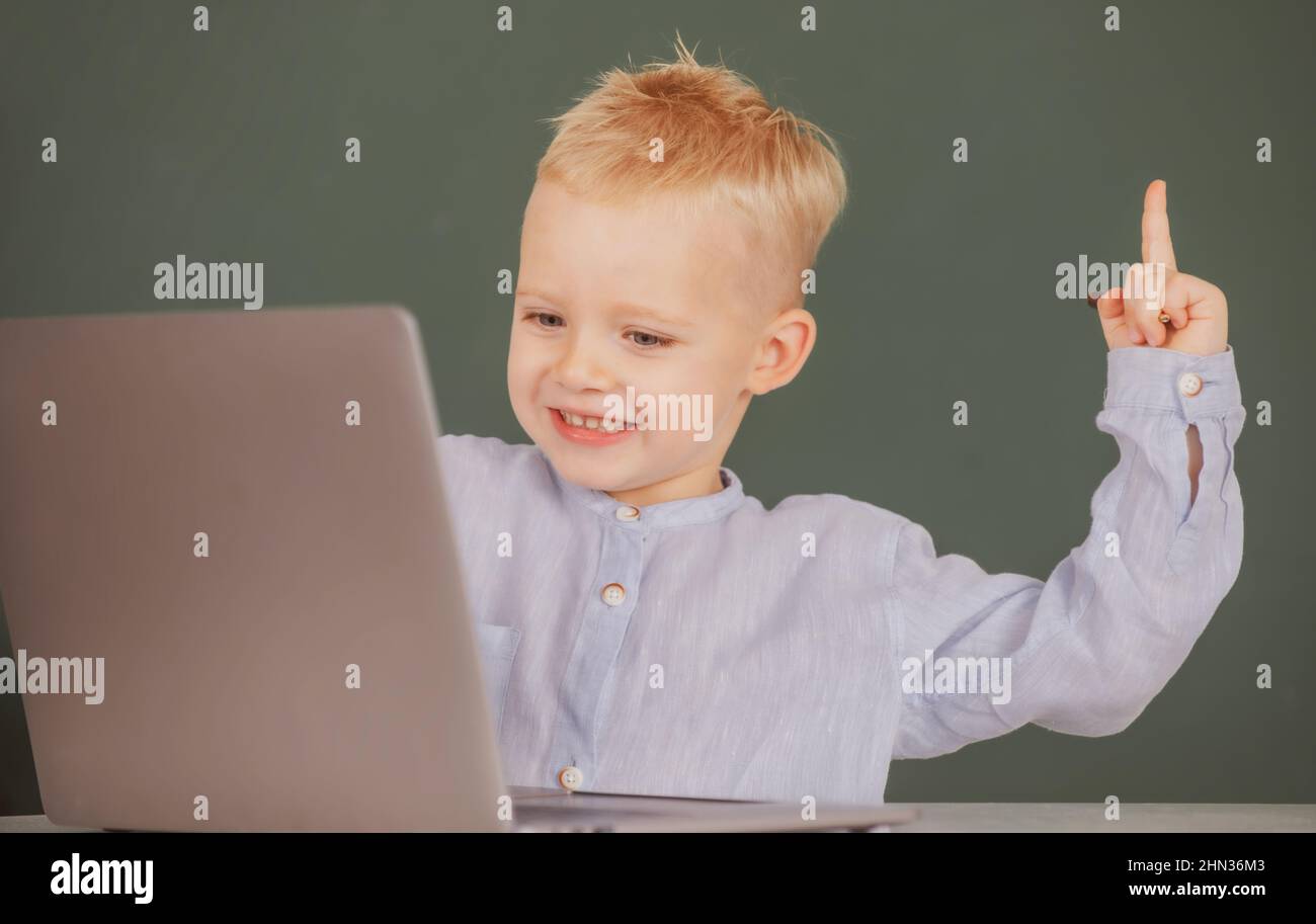 Amazed child using gadgets to study. Computer education for kids ...