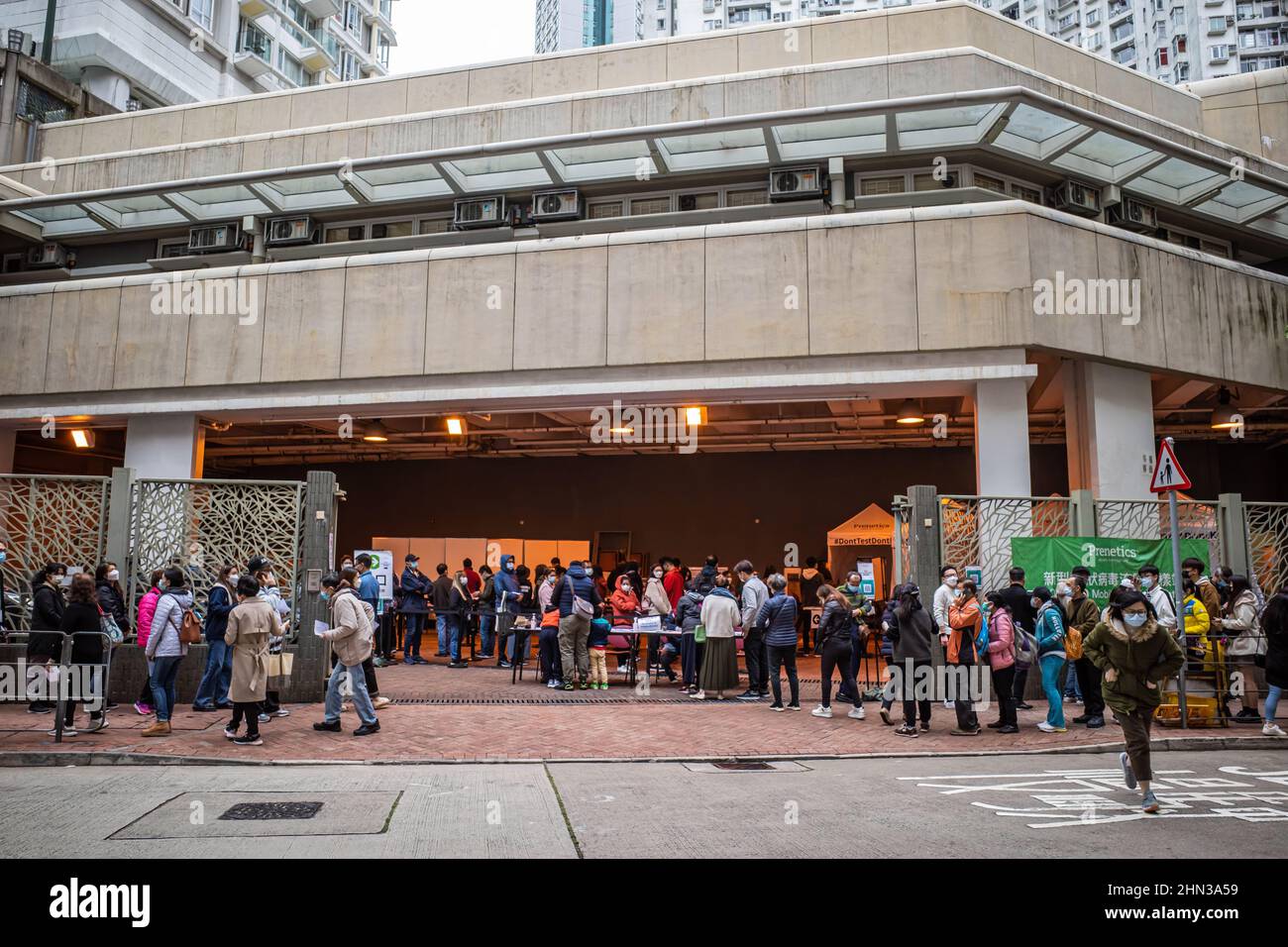 Hong Kong residents line up at a Community Testing Centre. With the