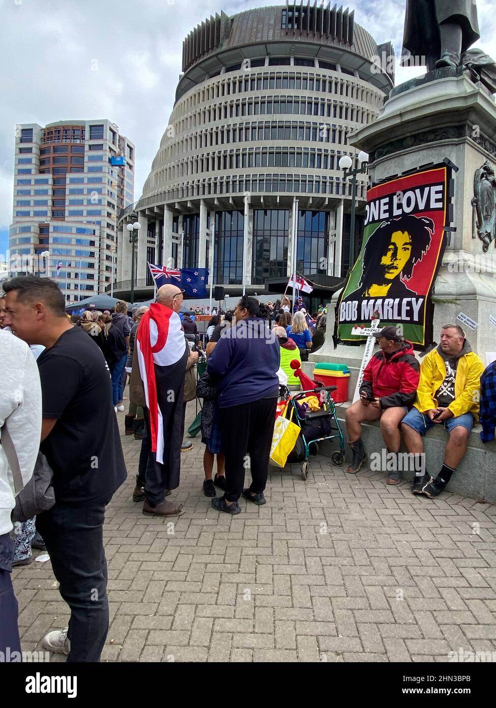 Protesters against the coronavirus disease (COVID-19) restrictions and vaccine mandates gather in front of the parliament in Wellington, New Zealand, February 14, 2022. REUTERS/Praveen Menon Stock Photo