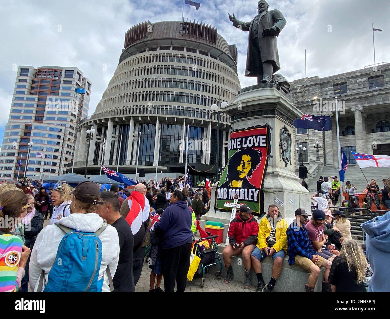 Protesters against the coronavirus disease (COVID-19) restrictions and vaccine mandates gather as they camp in front of the parliament in Wellington, New Zealand, February 14, 2022. REUTERS/Praveen Menon Stock Photo