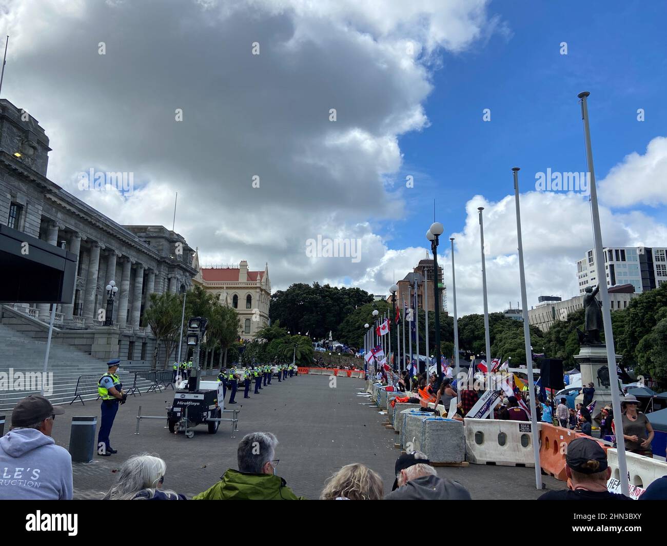 Protesters against the coronavirus disease (COVID-19) restrictions and vaccine mandates gather in front of the parliament in Wellington, New Zealand, February 14, 2022. REUTERS/Praveen Menon Stock Photo