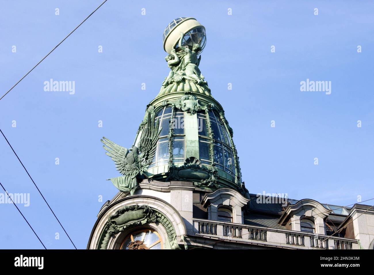 Skylight, topped with the globe, sculptural decorations of the early 20th-century historic landmark Singer House at Nevsky Prospekt, St. Petersburg Stock Photo