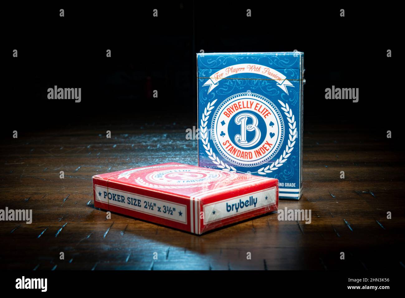SAINT CLOUD, MINNESOTA - 11 FEBRUARY, 2022: Two packs of Brybelly Elite playing cards sit on a wooden table. Stock Photo