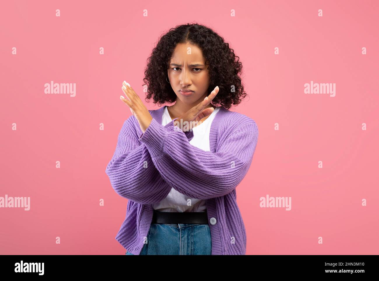 Millennial African American woman gesturing STOP, refusing something on pink studio background Stock Photo