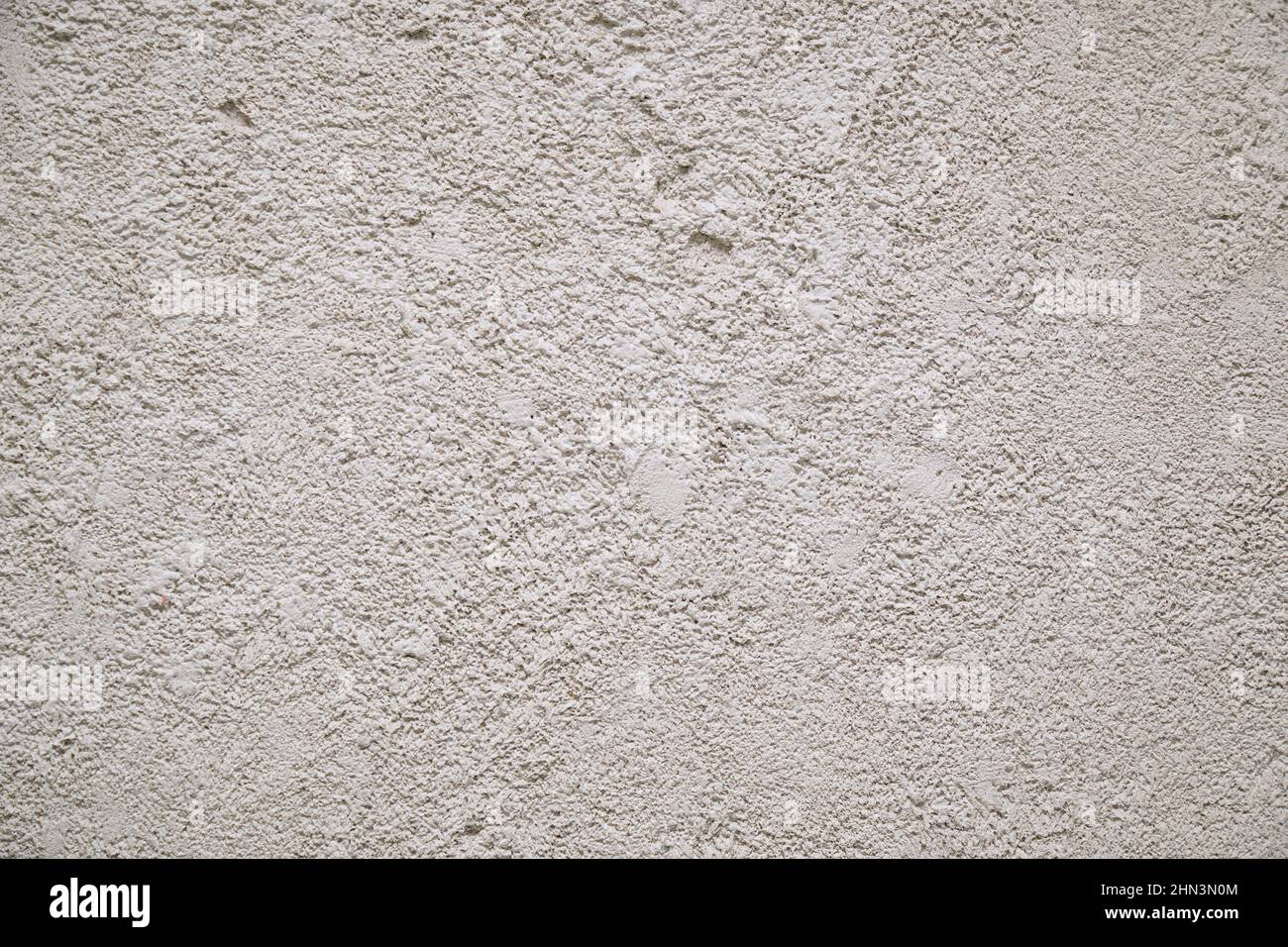 The wall is covered with gray decorative plaster Stock Photo