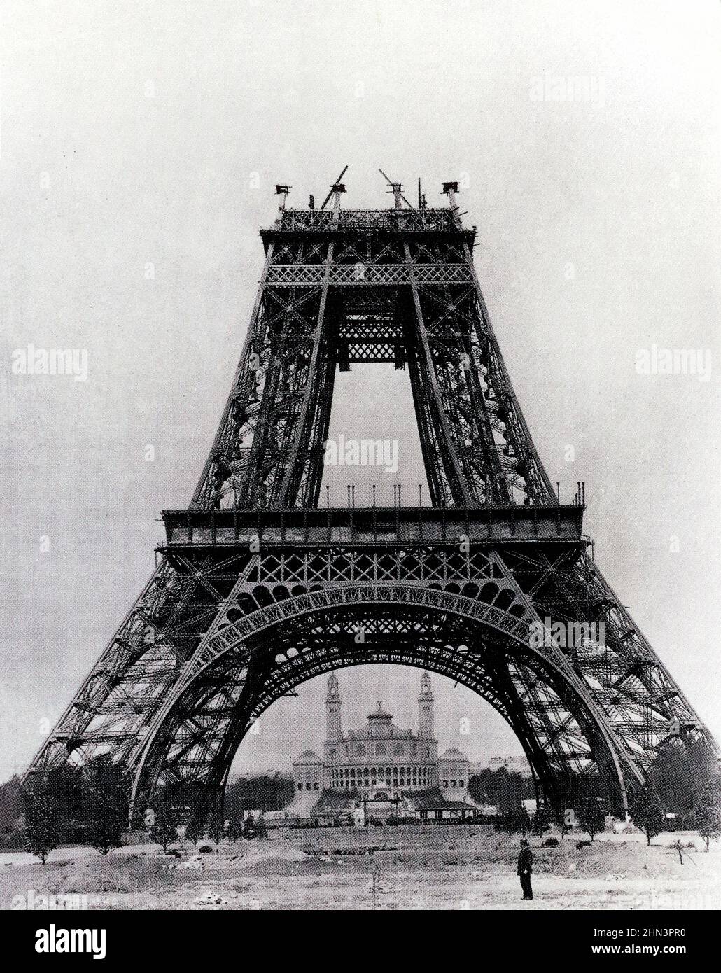 The 19th century vintage photo of construction work of the Eiffel Tower with Palais du Trocadéro on the background. 1888. Paris, France. Stock Photo