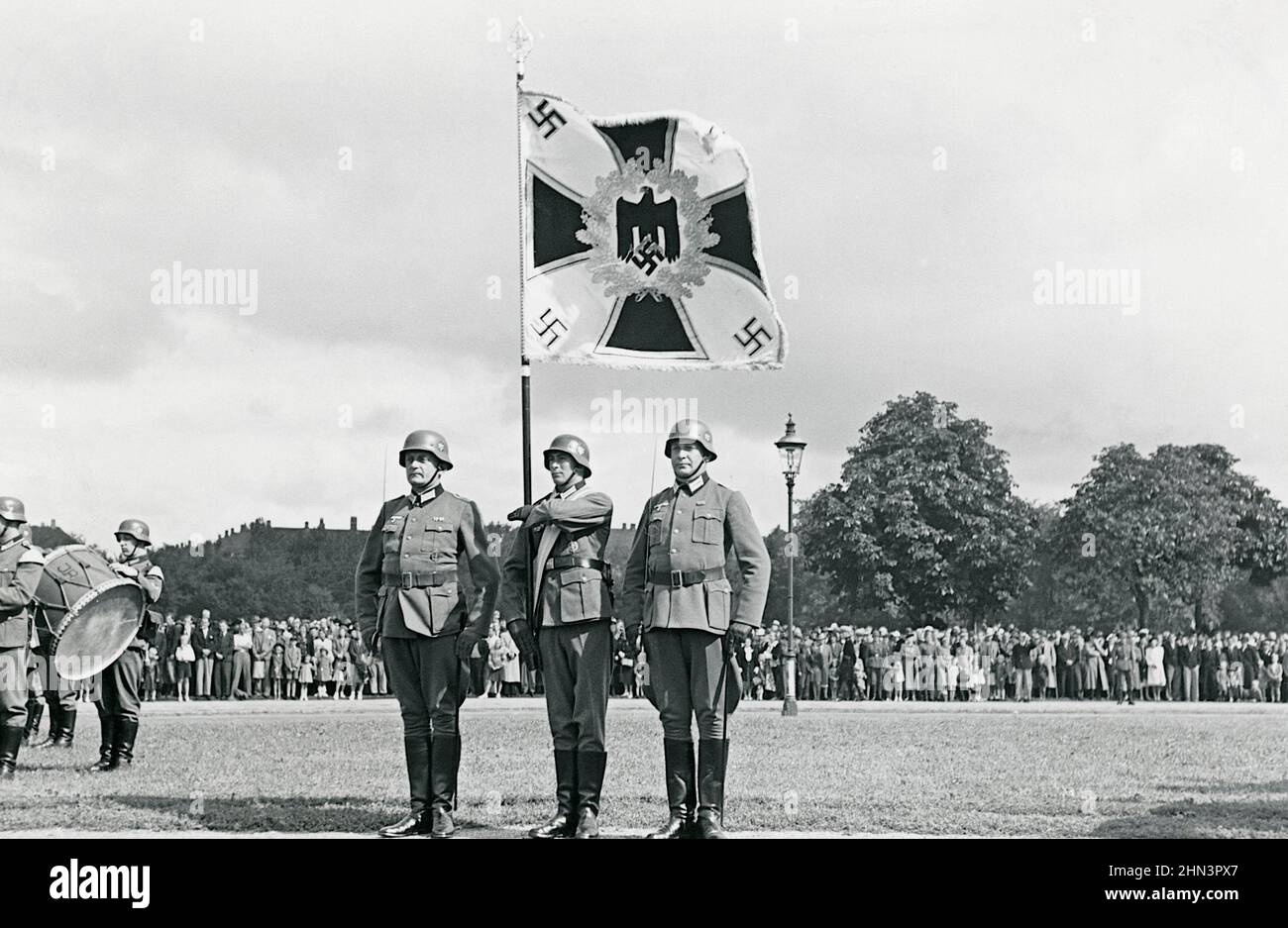 Vintage photo of the parade of general Lüdke (supreme commander of the German forces in Denmark ). German standard bearer in the foreground. Denmark. Stock Photo