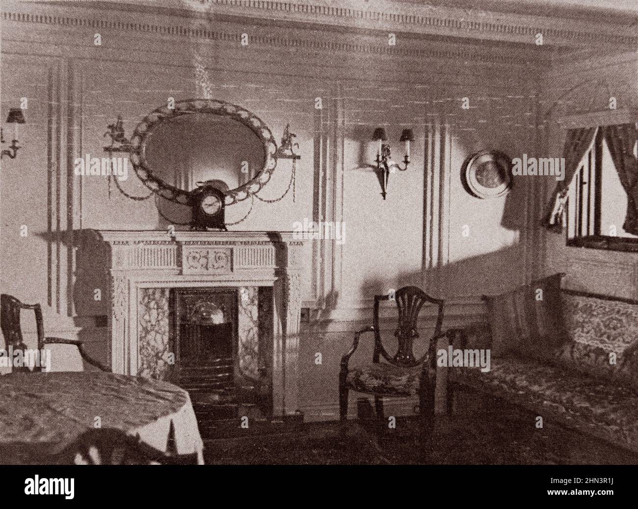 Vintage photo of Titanic liner's interior: The lounge. 1912 Two rooms (the bedroom and lounge) in a private apartment, the cost of which was approxima Stock Photo