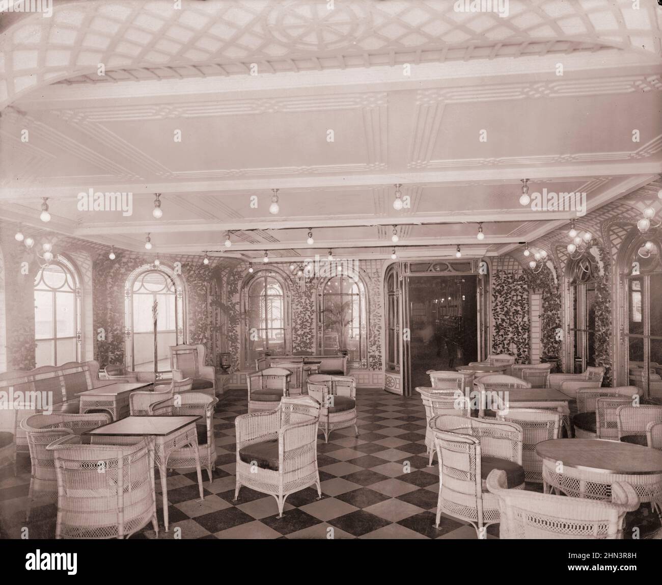 Vintage photo of exterior of the 'Titanic' liner: The veranda cafe and palm court. 1912 Stock Photo