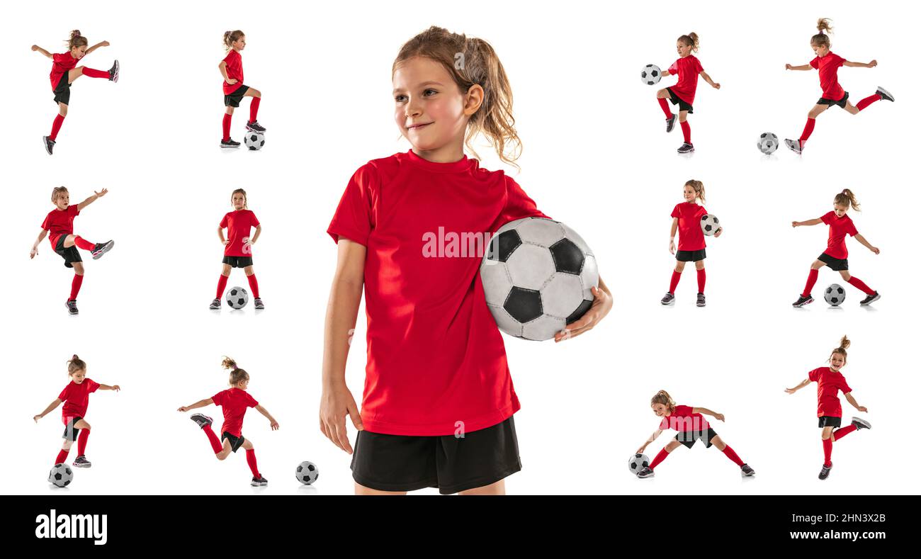 Portraits of little girl, child, training, playing football isolated over white studio