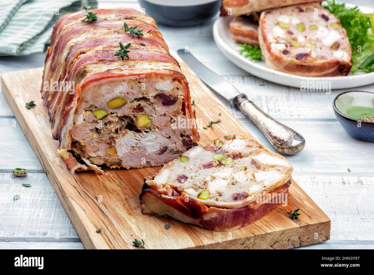 Terrine of pork with pistachios, cherries, chicken and bacon Stock