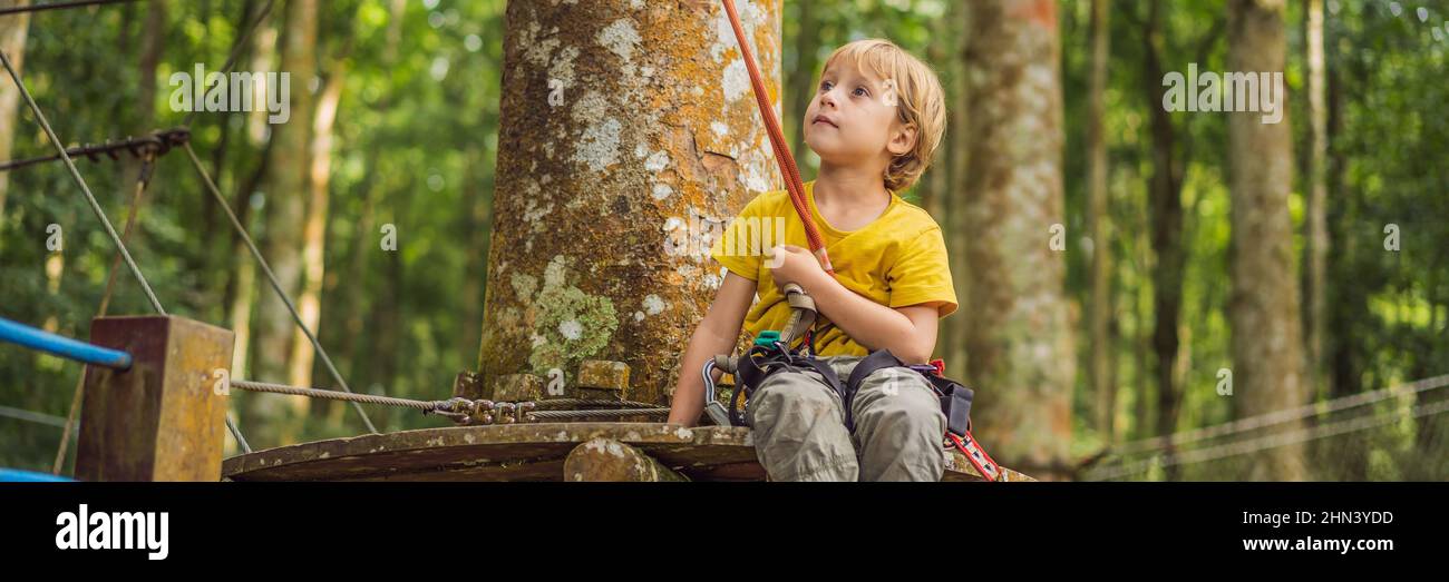 Little boy in a rope park. Active physical recreation of the child in