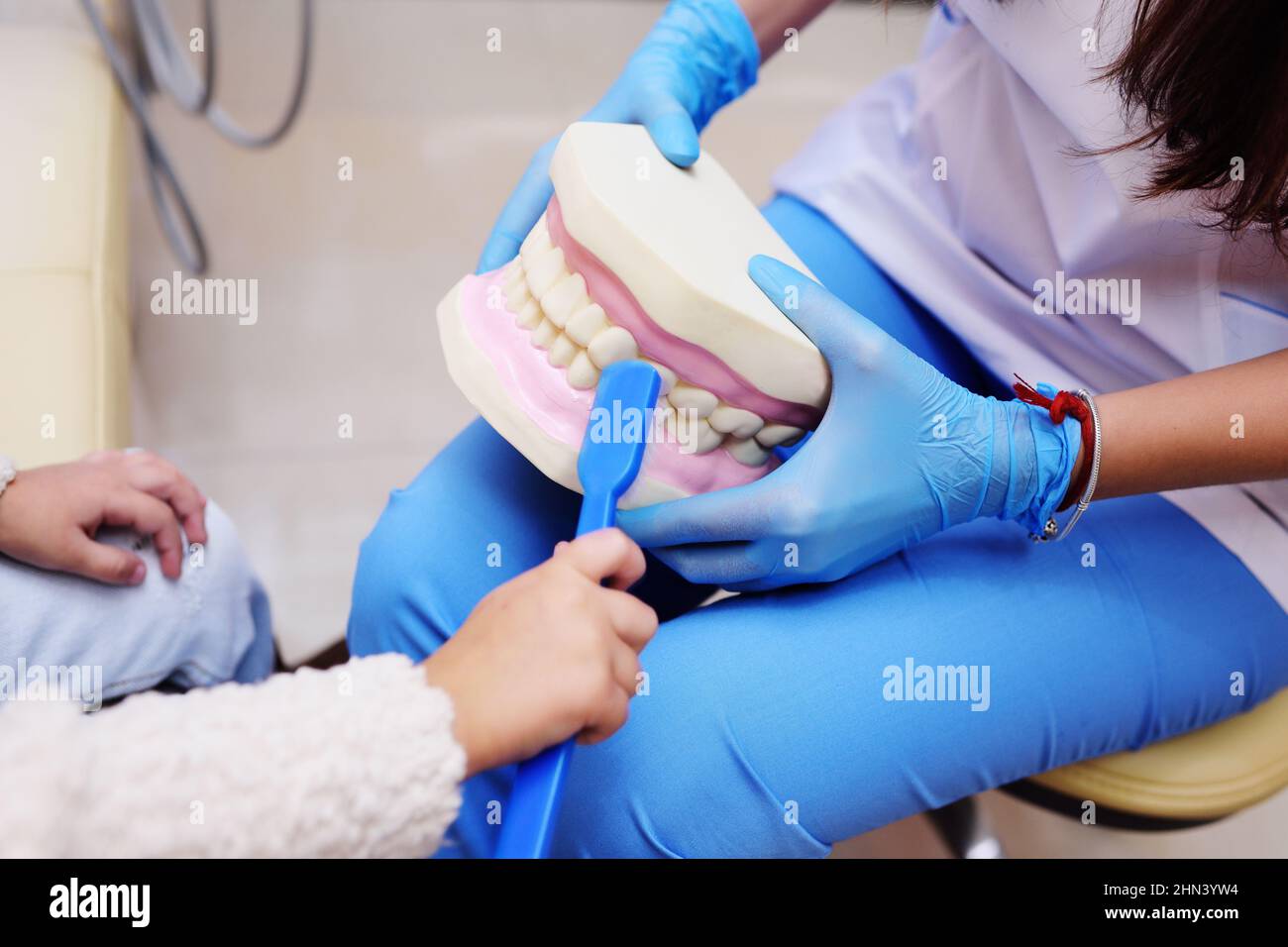 The dentist tells the child about oral hygiene Stock Photo Alamy