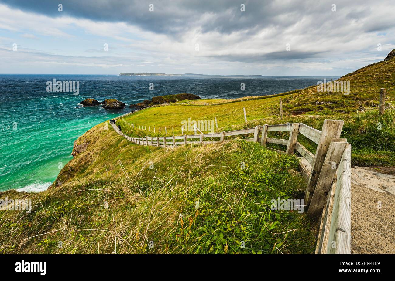 Curvy trail in a travel destination, Northern Ireland. Snaky path points toward a destination difficult to reach with the concept of many difficulties Stock Photo