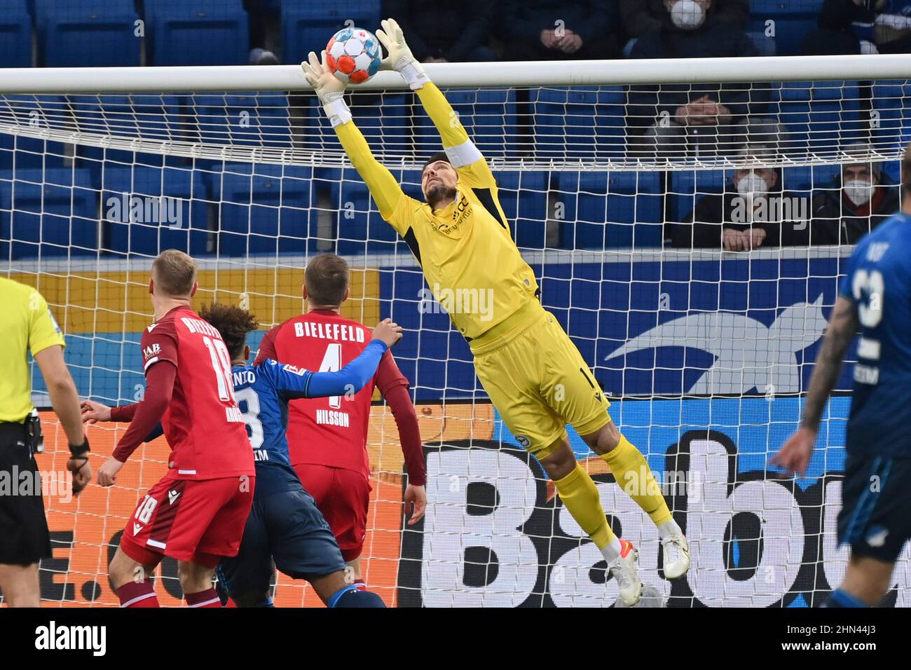 Munich's goalkeeper Stefan Ortega Moreno (R) catches the penalty shot by  Andreas Geipl of Regensburg (2-R) during the 2. Bundesliga relegation match  between Jahn Regensburg and TSV 1860 Munich at the Continental