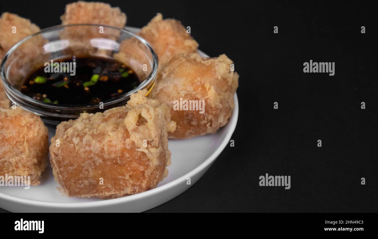 cut out Fried tofu with chilli soybean sauce in the middle Stock Photo