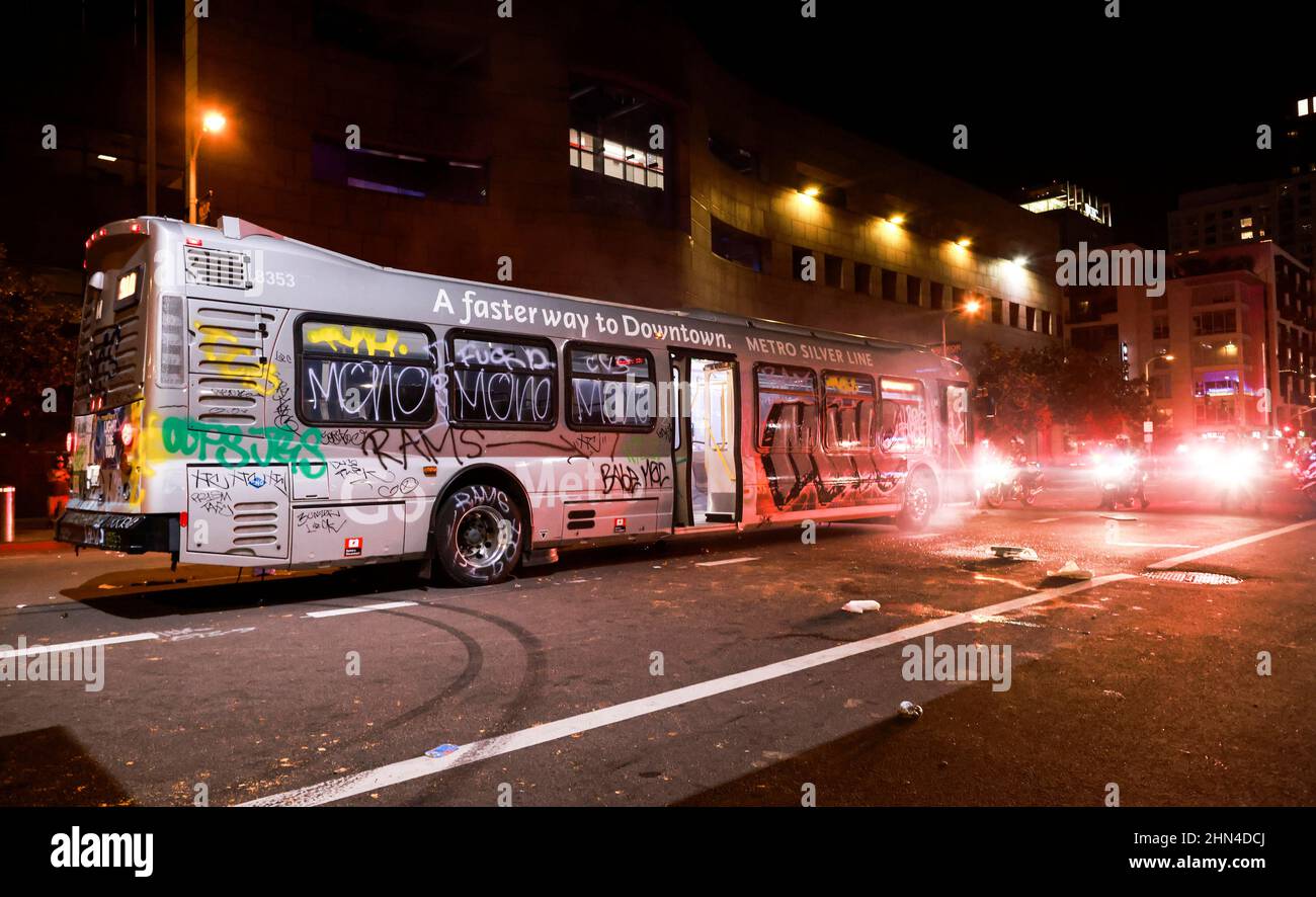 Law enforcement officers prepare to disperse a crowd after a public transportation  bus was spray painted during the celebration of Los Angeles Rams Super Bowl  LVI victory over the Cincinnati Bengals, in
