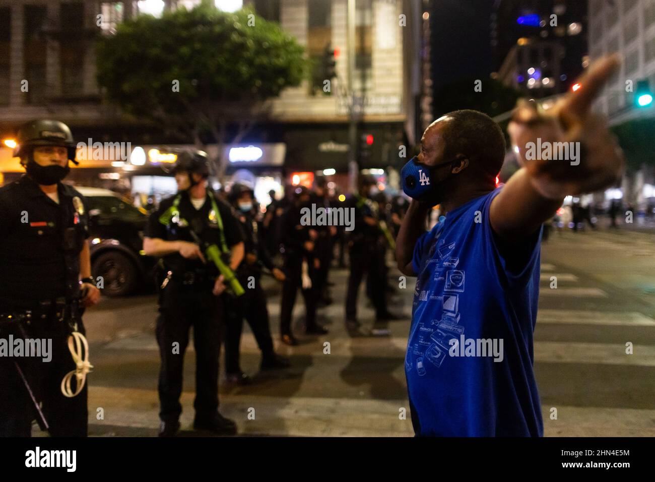 Nfl Riot Los Angeles, USA. 13th Feb, 2022. A man tries to pass a line of riot ...
