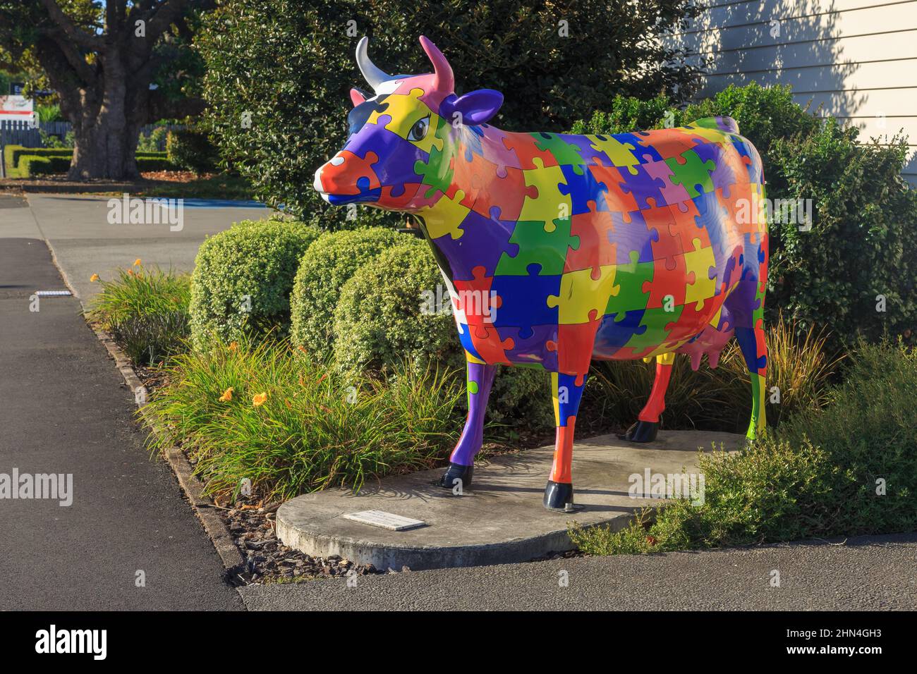Morrinsville, New Zealand. A life-sized cow sculpture, one of many in the town. This one has a jigsaw pattern and is called 'piece of the puzzle' Stock Photo