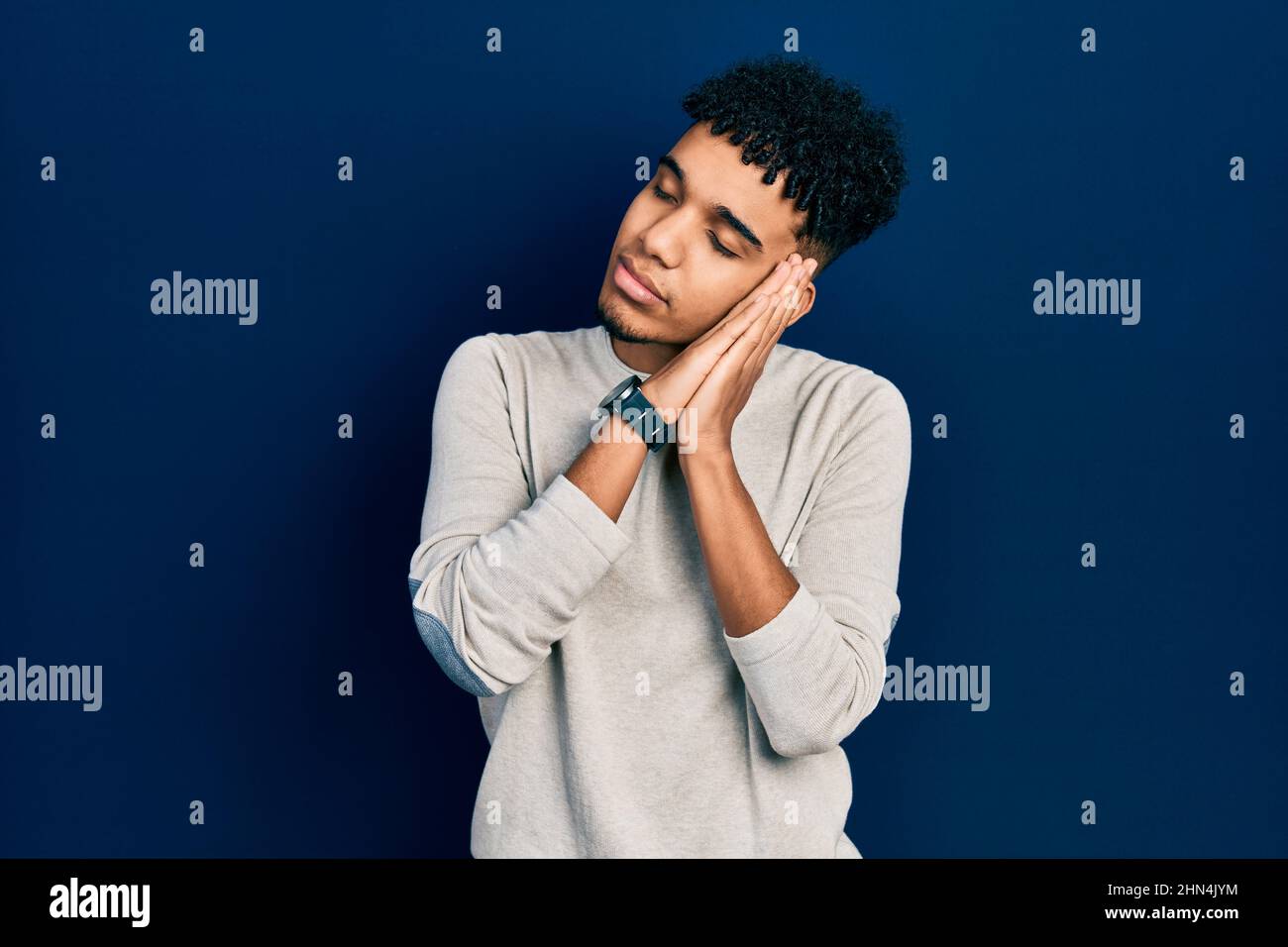 Young african american man wearing casual clothes sleeping tired ...