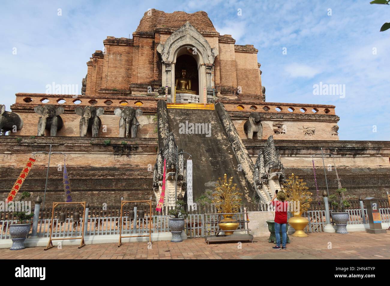Tourist taking a photograph  in front of Wat Chedi Luang, Chiang Mai, Thailand Stock Photo
