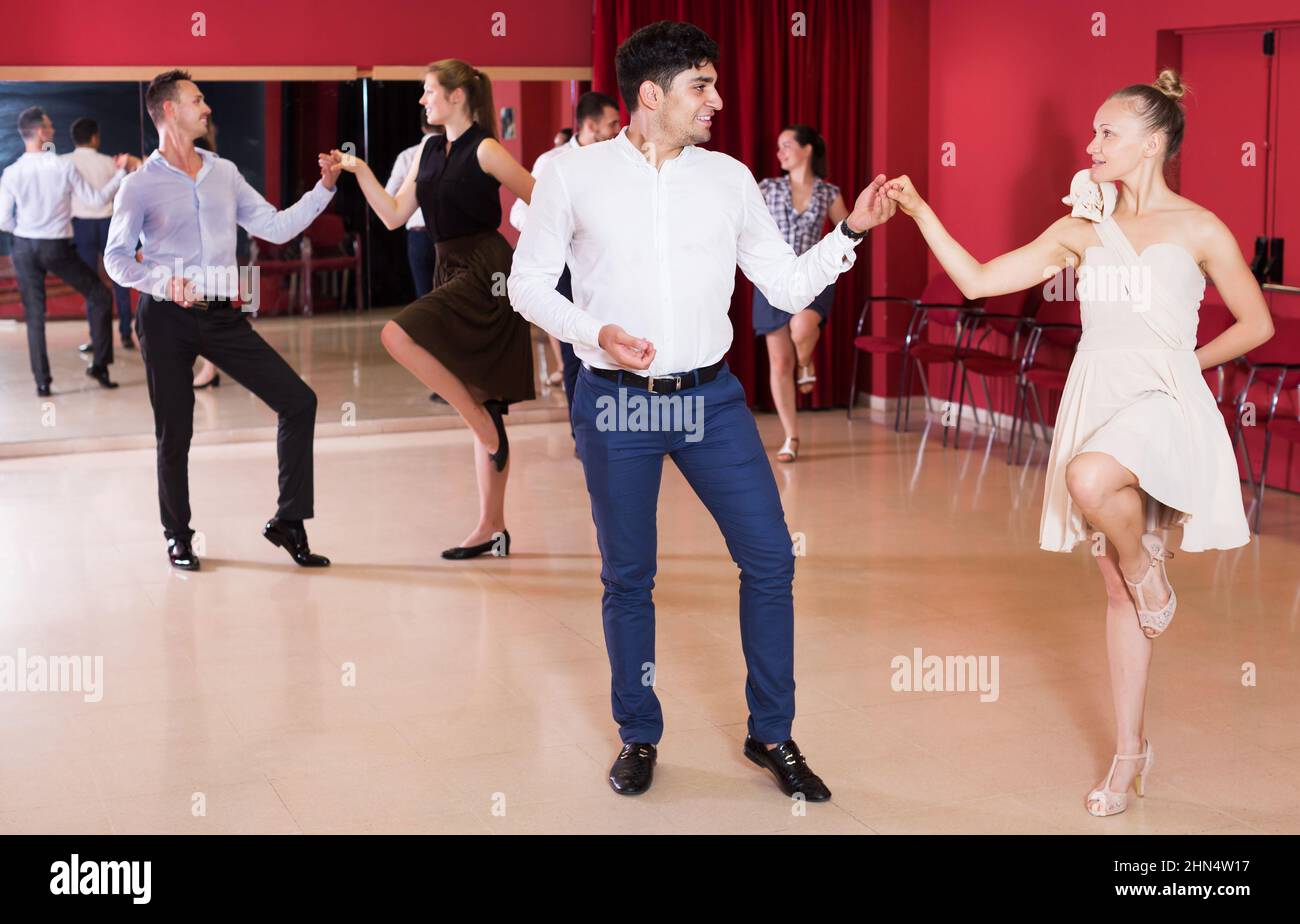 People practicing vigorous lindy hop movements Stock Photo