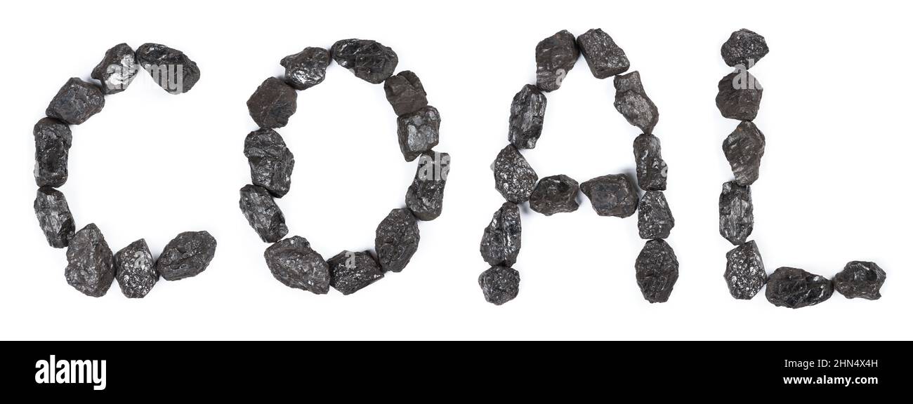 Word Coal made from black stone coal isolated on white background top